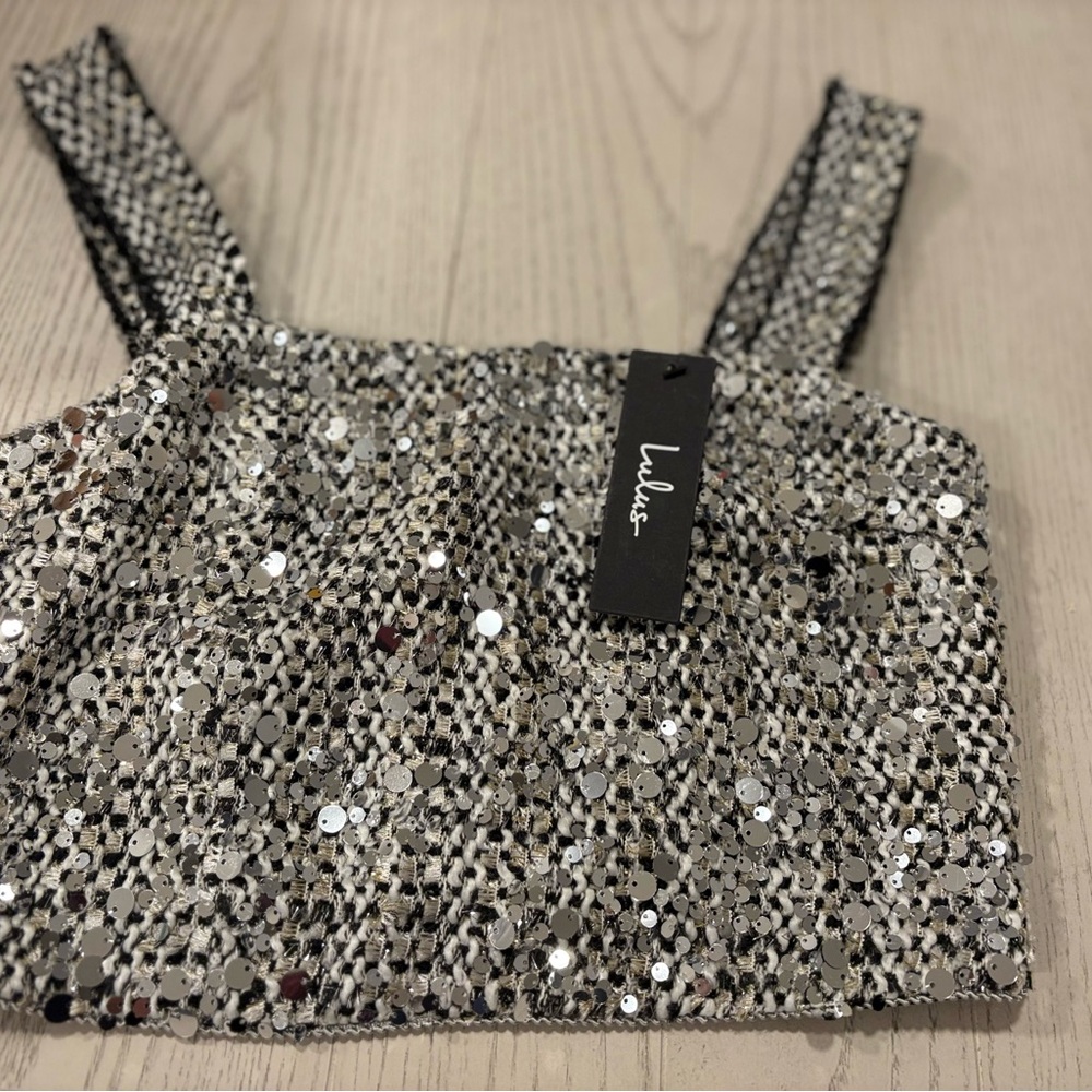 Lulu's Glittering Black and Silver Crop Top
NWT Free Shipping
Size Small